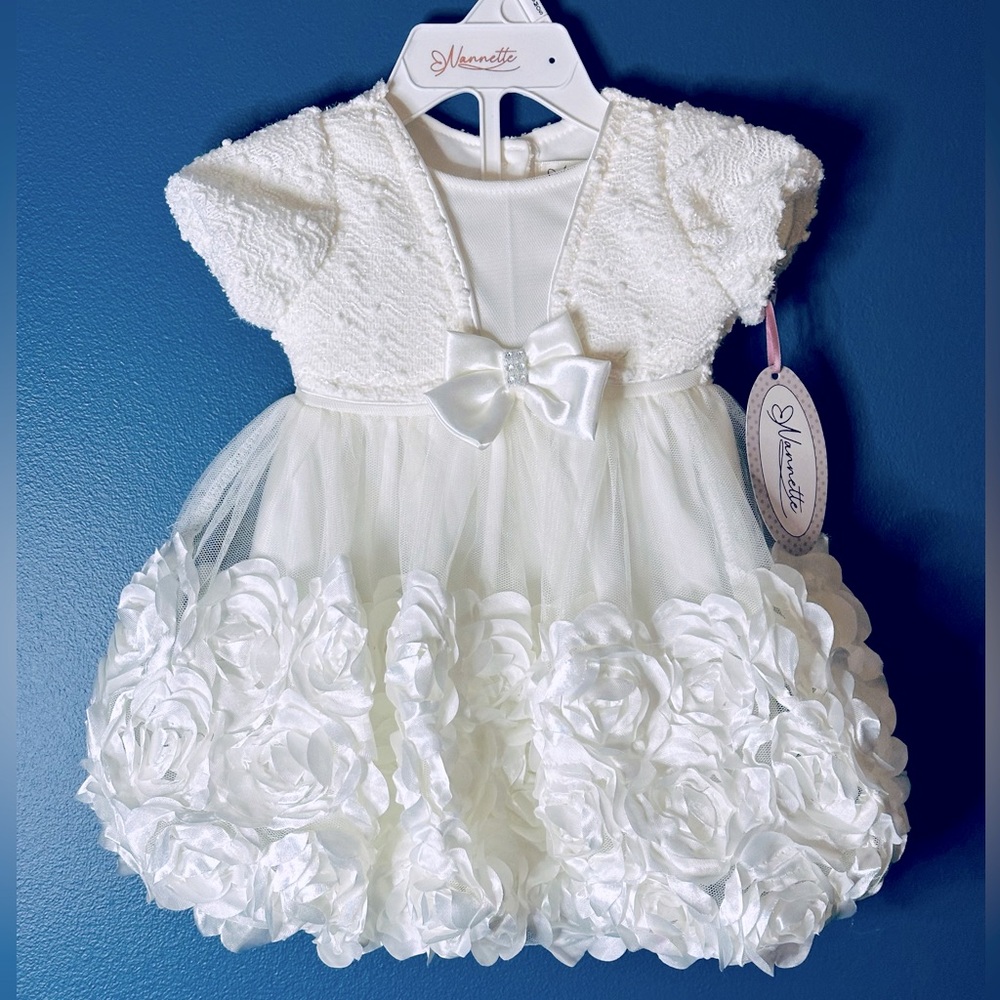 Nannette little girl’s dress size 6-9 months. Creamy white